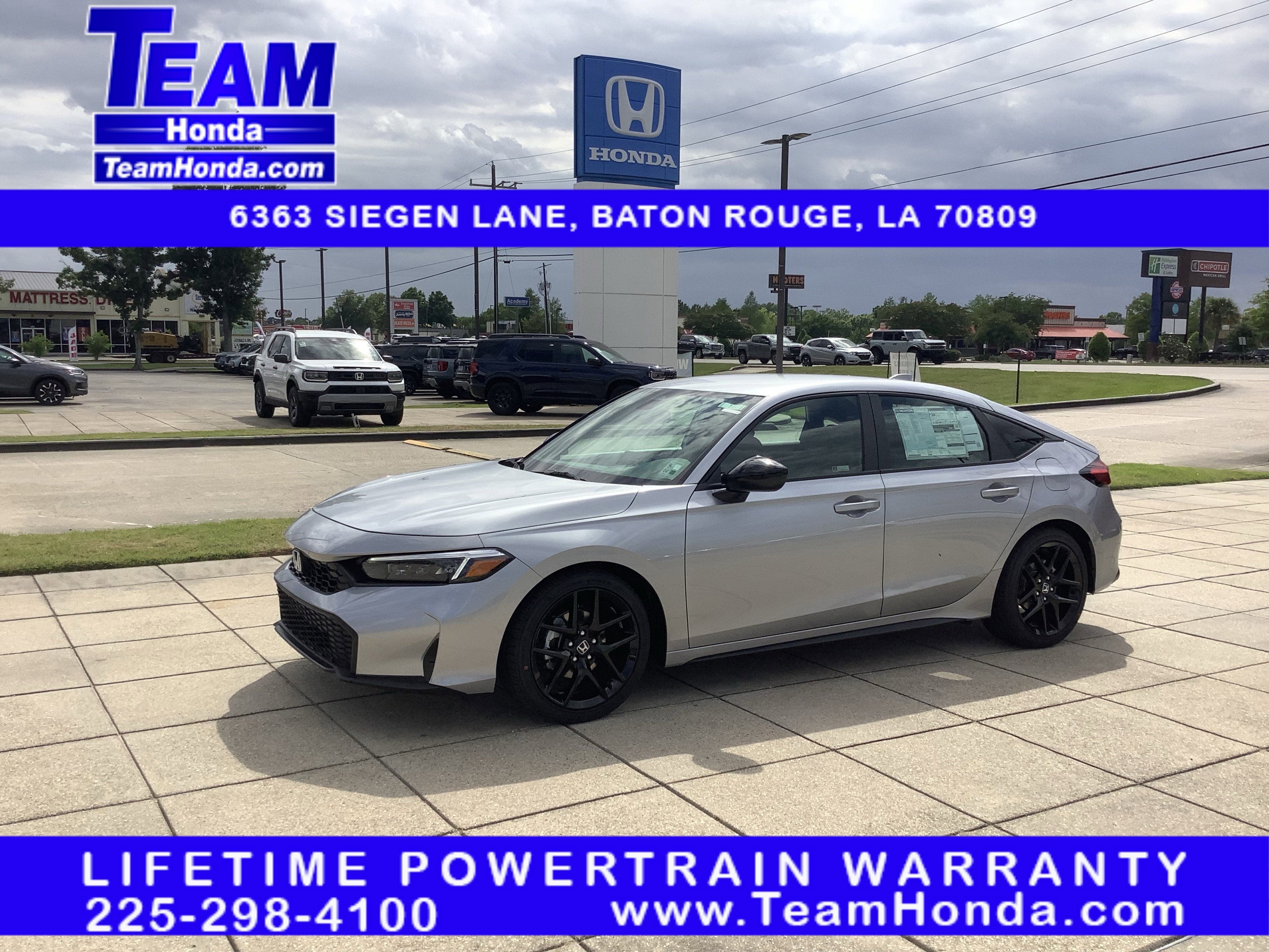 2026 Honda Civic Hatchback Sport in Solar Silver Metallic — front three-quarter view