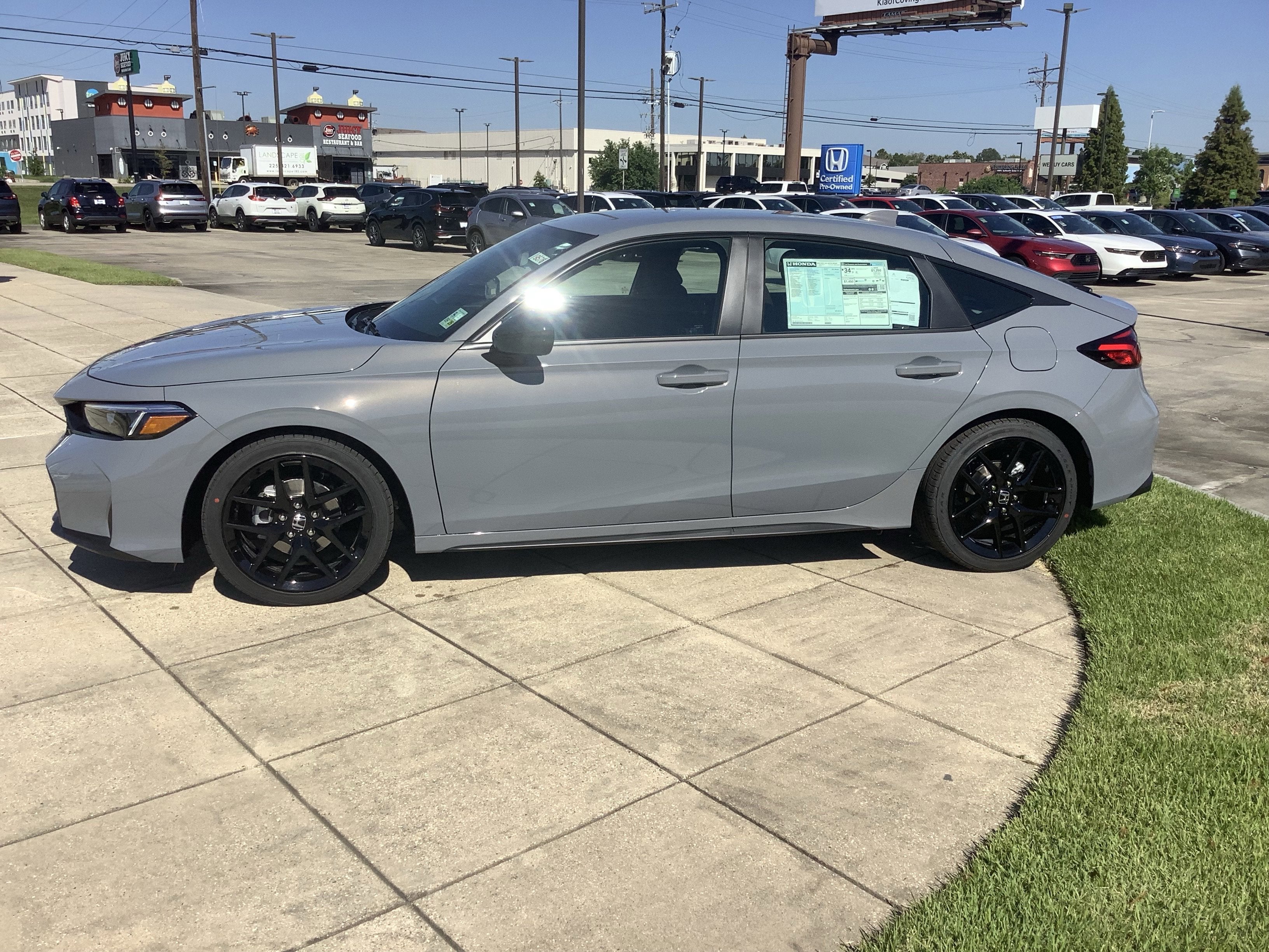 2026 Honda Civic Hatchback — rear three-quarter view