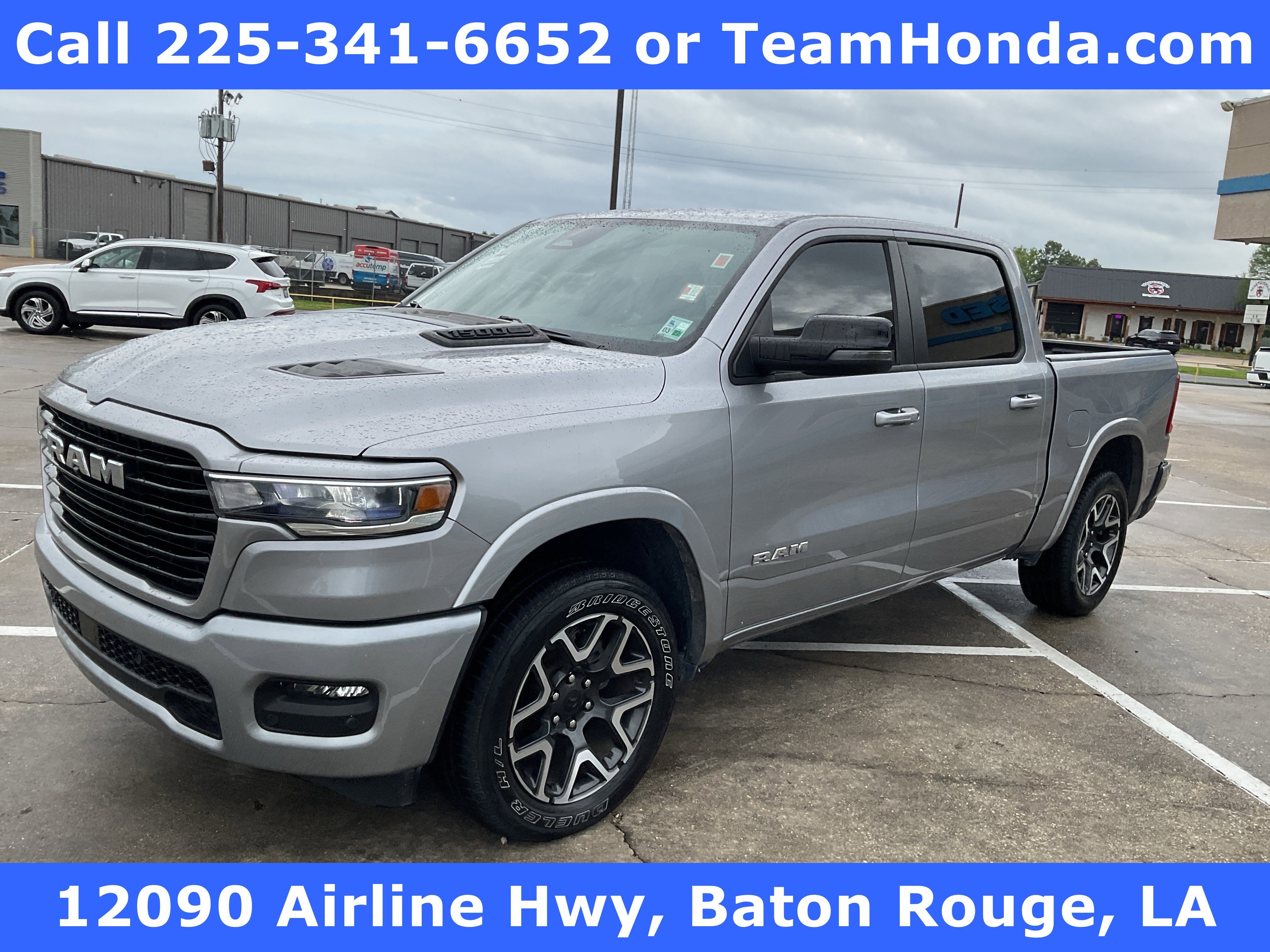 2025 RAM 1500 Laramie in Billet Silver Metallic Clearcoat — front three-quarter view