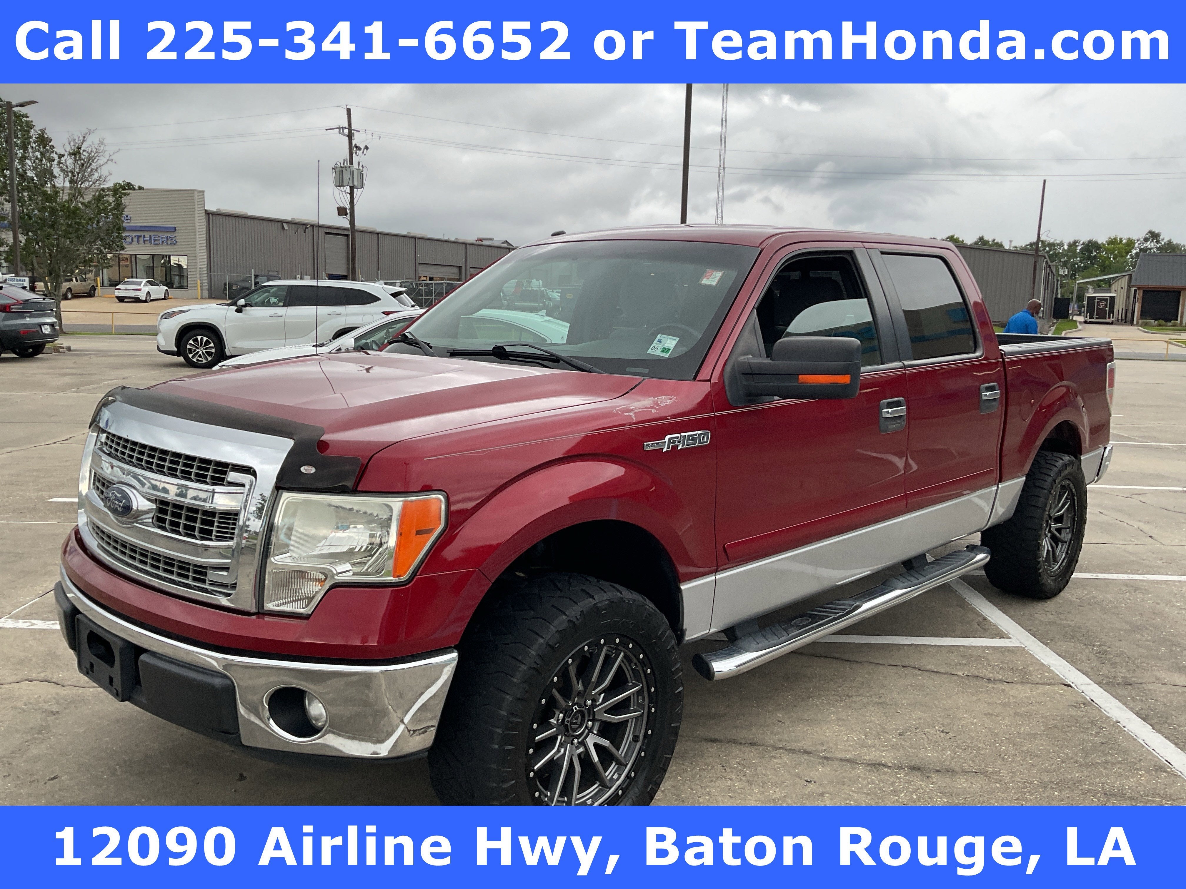2013 Ford F-150 XLT in Ruby Red Metallic Tinted Clearcoat — front three-quarter view