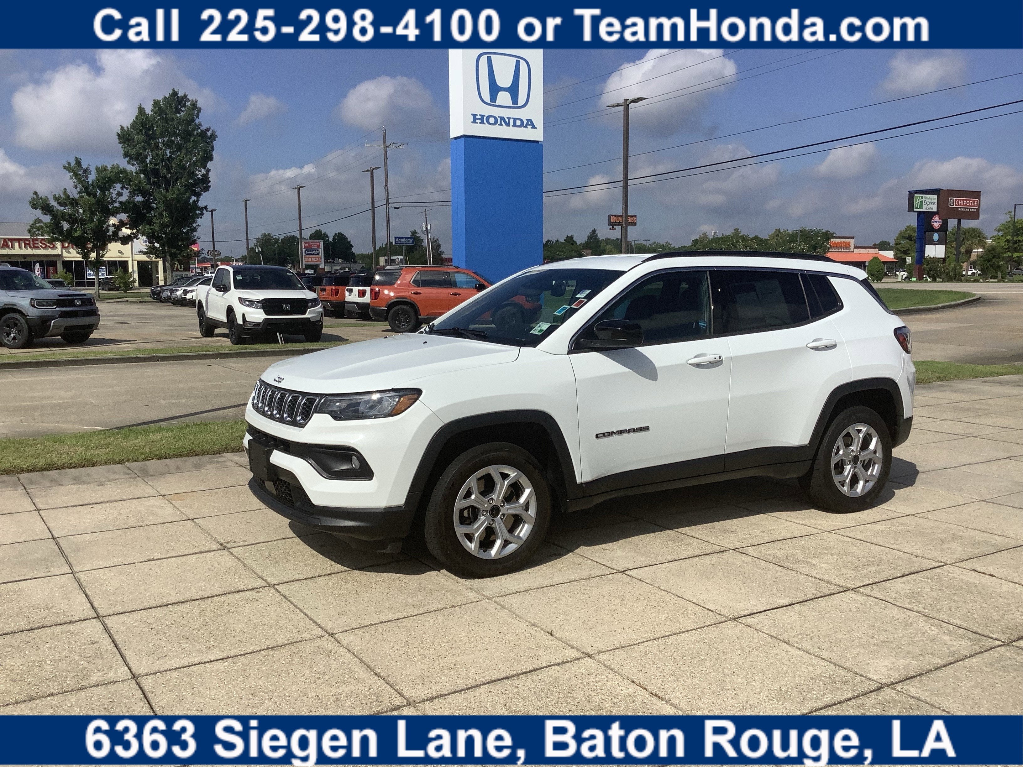 2025 Jeep Compass Latitude in Bright White Clearcoat — front three-quarter view