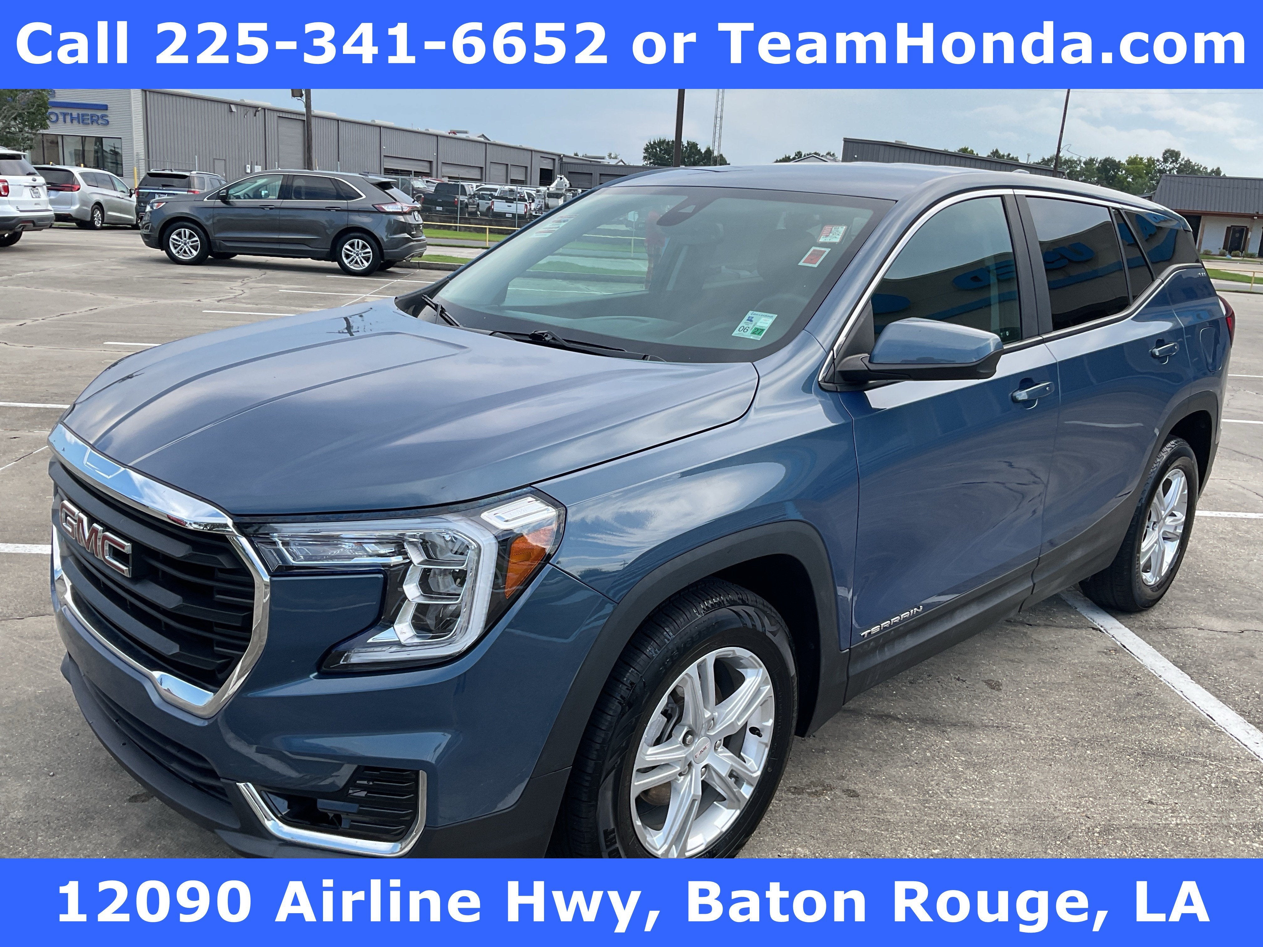2024 GMC Terrain SLE in Downpour Metallic — front three-quarter view
