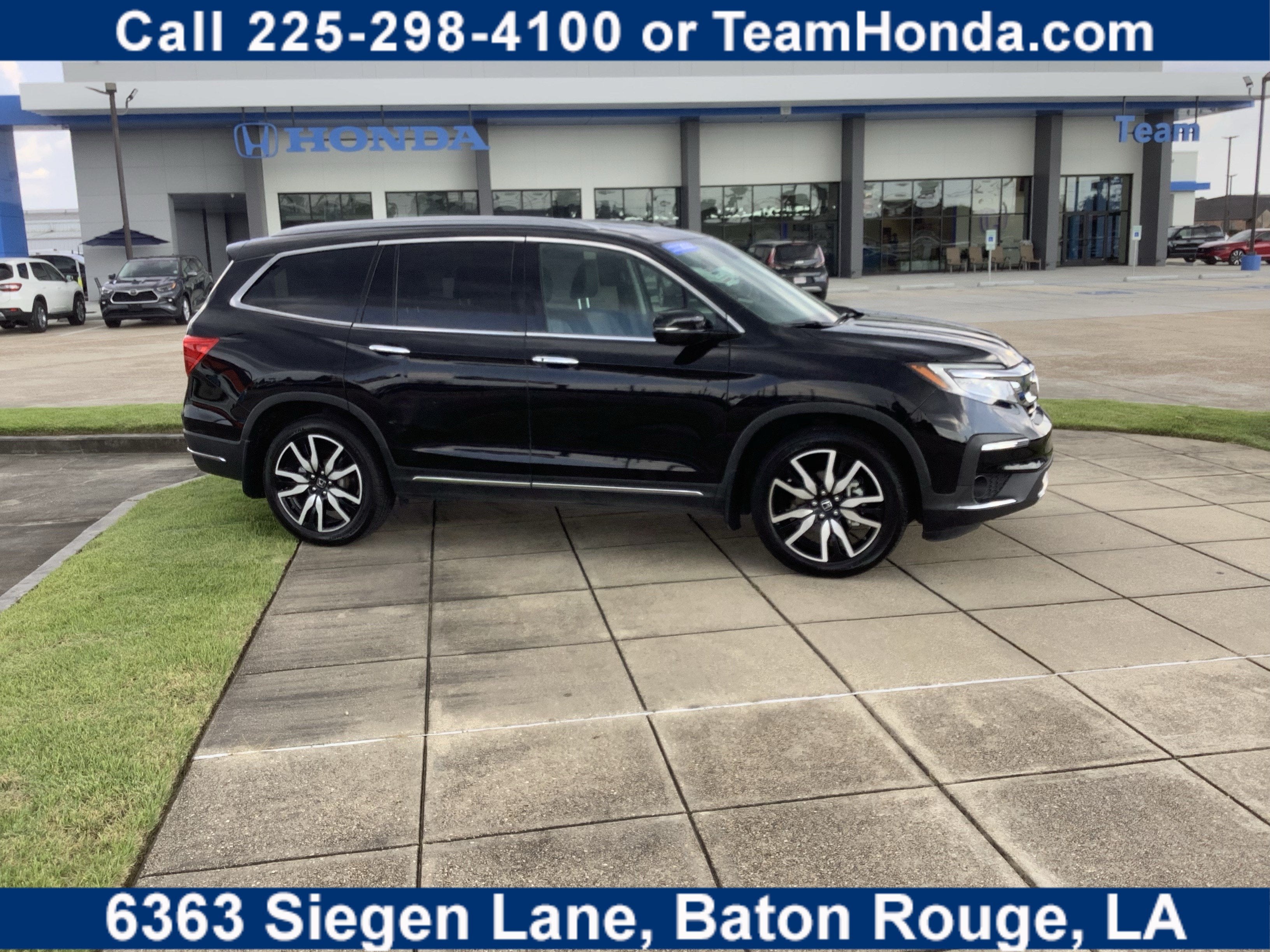 2022 Honda Pilot Touring 7-Passenger in Crystal Black Pearl — front three-quarter view