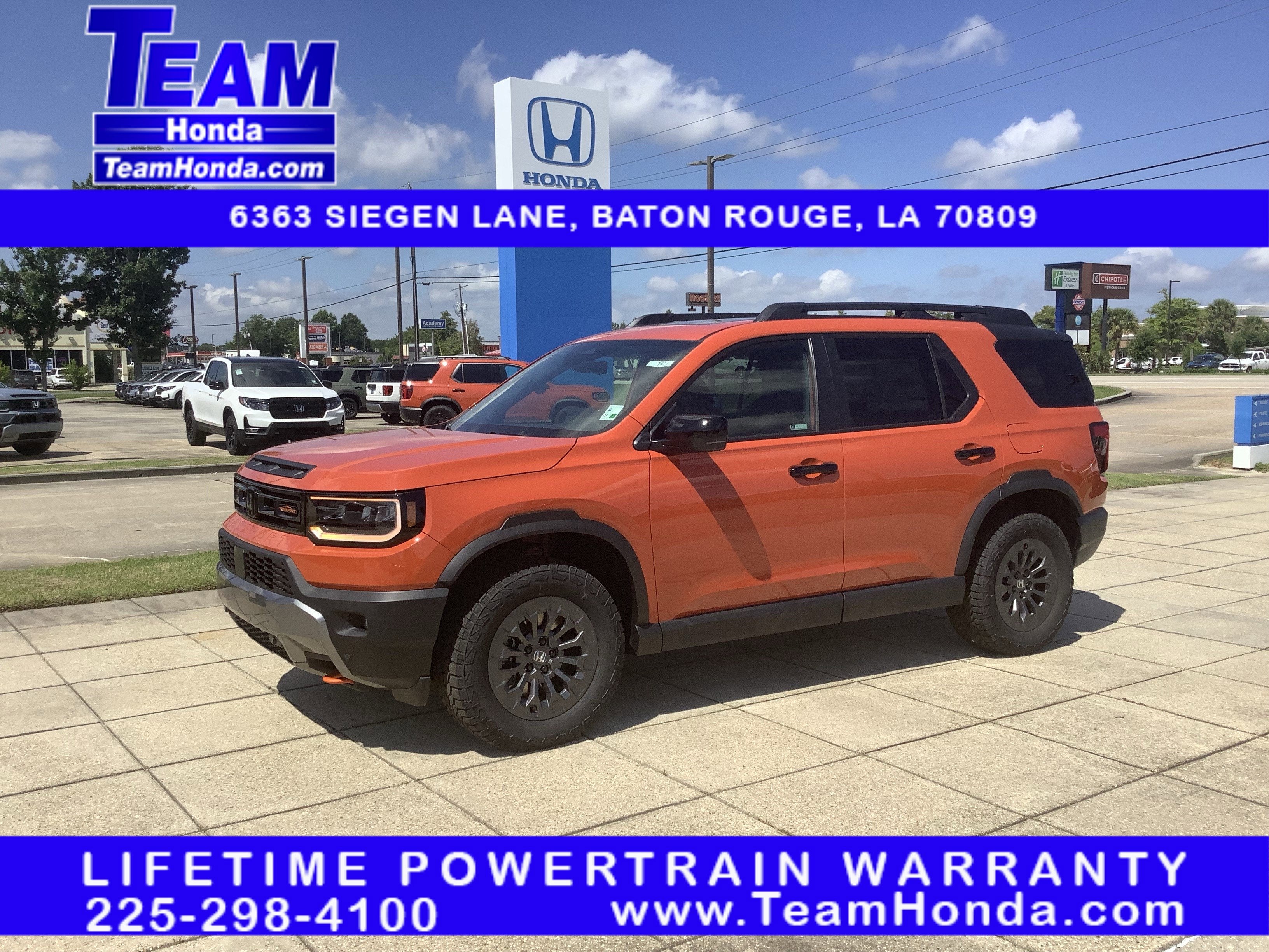 2026 Honda Passport TrailSport in Sunset Orange — front three-quarter view