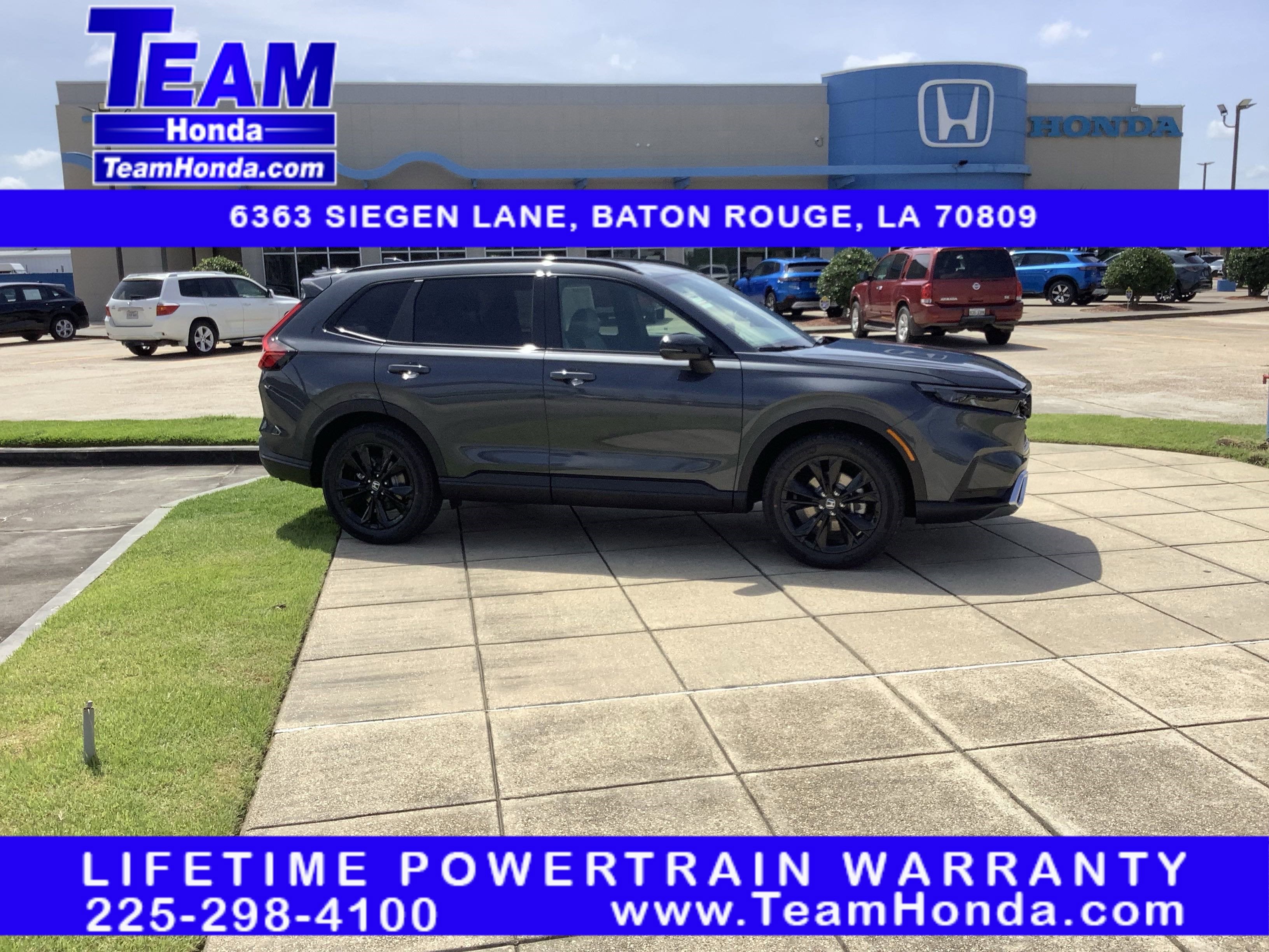 2026 Honda CR-V Hybrid Sport Touring in Meteorite Gray Metallic — front three-quarter view