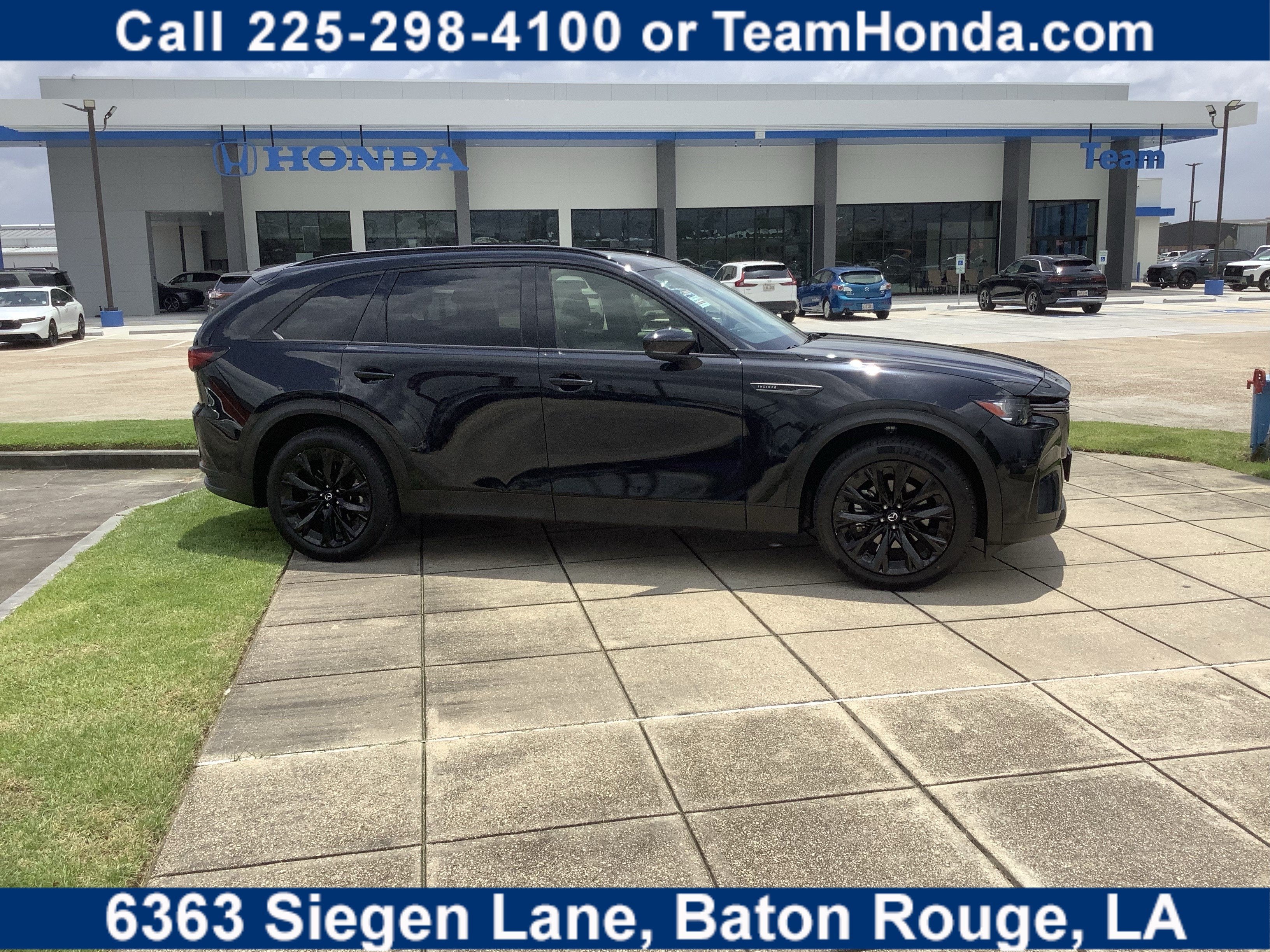 2025 Mazda Mazda CX-90 Premium Sport in Jet Black Mica — front three-quarter view